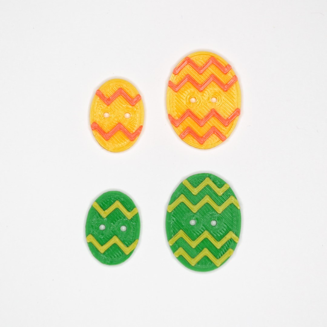 http://Påskeeggknapp%20med%20sikksakk Påskeeggknapp med sikksakk i gul og grønn variant